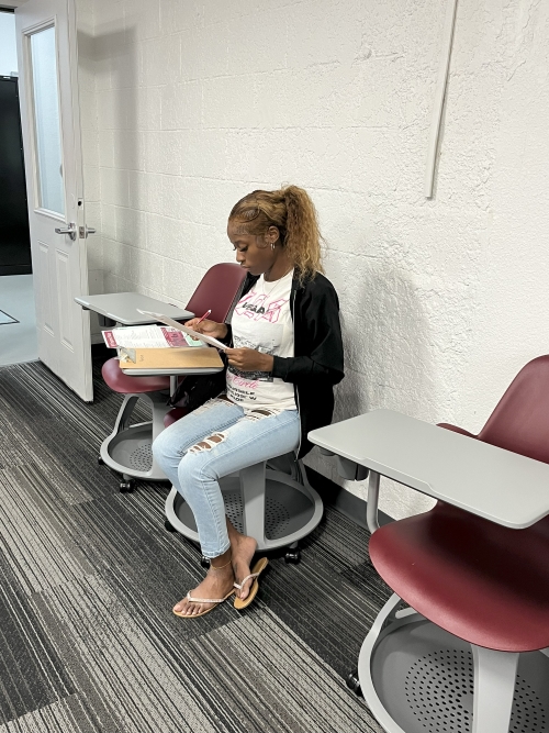 Student fills out application for NFC’s Perry Location