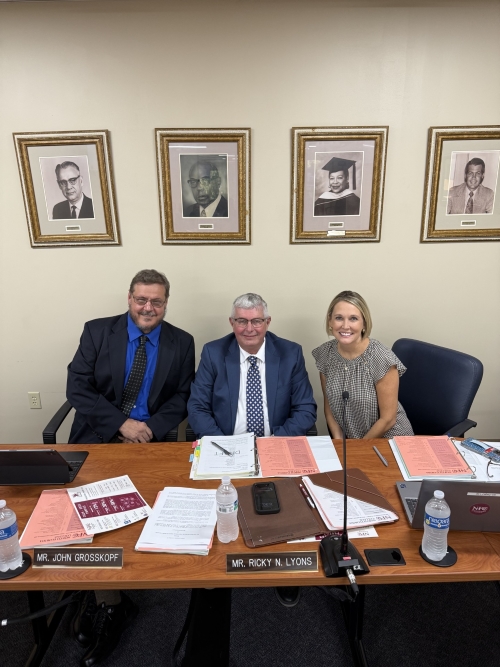 Dr. John Grosskopf, Board of Trustee Chair Ricky Lyons and Dr. Jennifer Humble Page