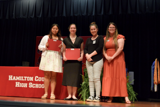 Caroline Mary Moffses Memorial Scholarship&nbsp;recipients Ana Hidalgo, Sarah Armstrong, NFC Coordinator of Scholarships Brienna Valentine pictured with First Federal Bank representative Casey Phelps.